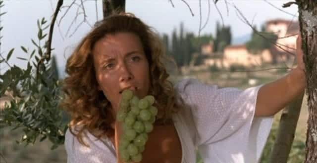 Emma Thompson speaks from the Much Ado About Nothing script as Beatrice, eating a bunch of grapes