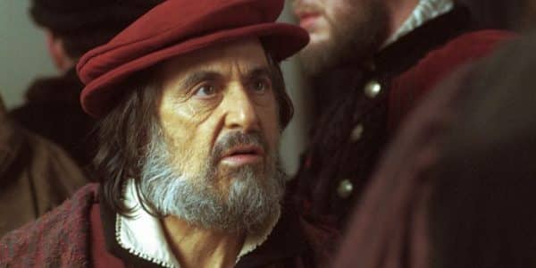 Shylock played by Al Pacino, dressed in burgundy hat and robes