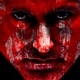 Close up picture of Macbeth with bloody face