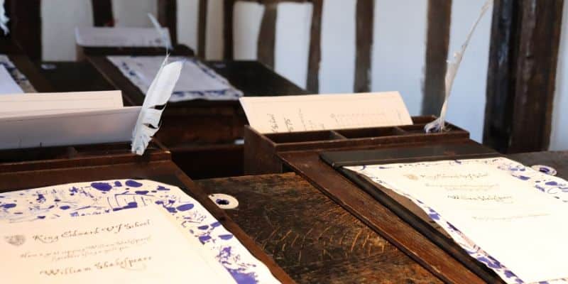 Closeup shot of old desk, quill and parchment, taken at Shakespeare's tudor school