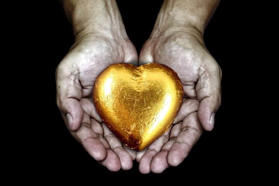 heart of gold, held in a pair of hands
